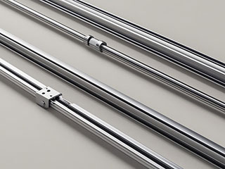 Close-up of high-quality, shiny garage door tracks and cables used in professional repairs and installation.
