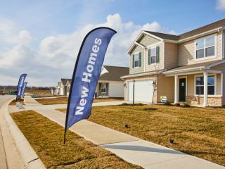 About Garage Door Repair Grayslake Front view of a suburban home with a new garage door and fenced yard in Treasure Island.